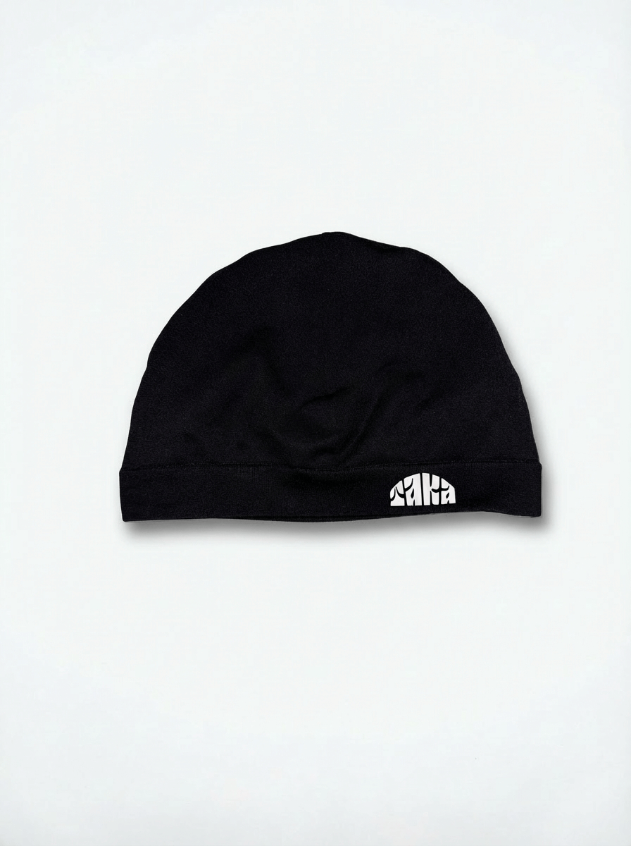 Satin lined skull cap in black by TAKA, designed to protect hair, keep them hydrated, and reduce frizz.